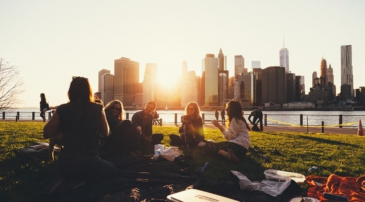 young adults having a picnic in the city