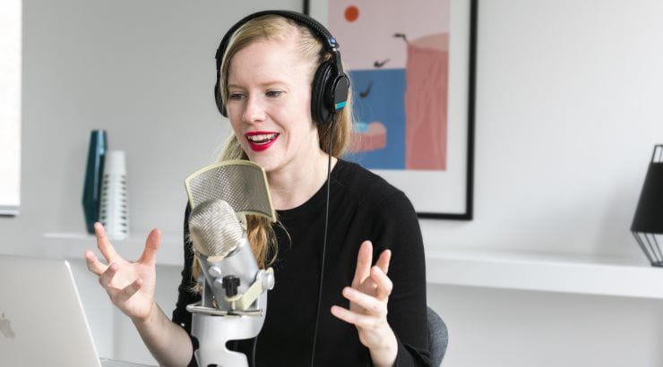 woman-recording-podcast-at-mic