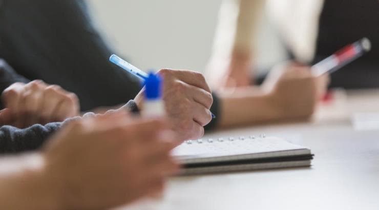 team-taking-meeting-notes