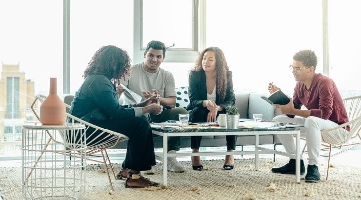 team-brainstorm-meeting-in-bright-sunny-office