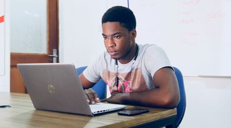 boy typing on laptop|Common App Writing Supplement|Common App ACT Tests|Common App Disciplinary Question|Common App Activities