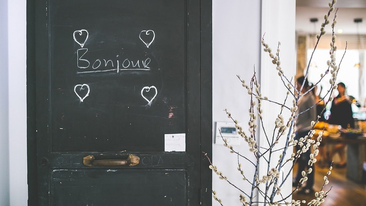 Bonjour written on black door