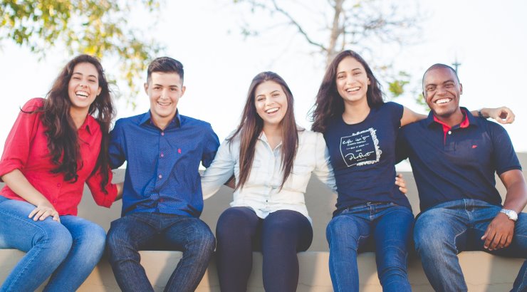 college students sitting on bench