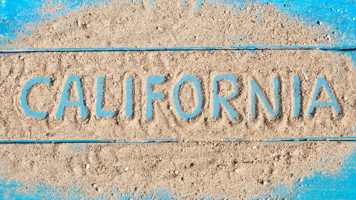California sign covered in sand