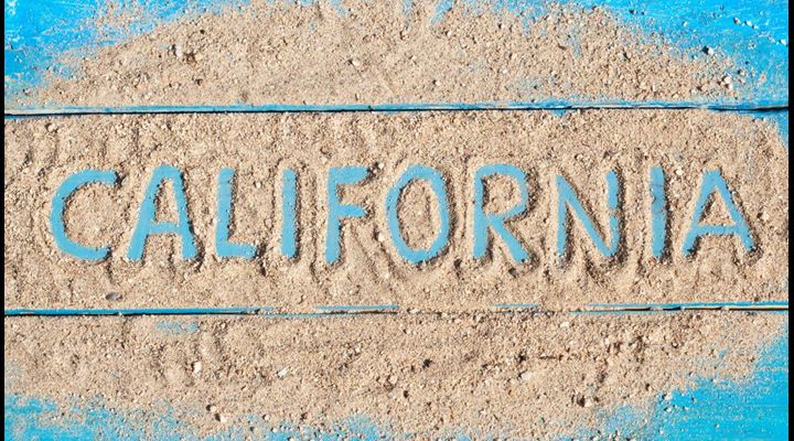 California sign covered in sand