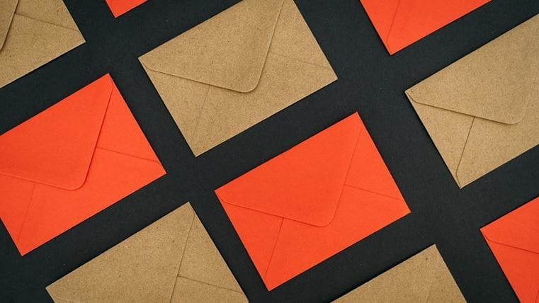 orange and brown envelopes on black background