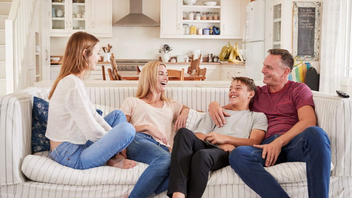 mom and dad and teens laughing